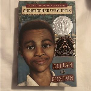 Scholastic Elijah of Buxton Book with Silver and Bronze Accents